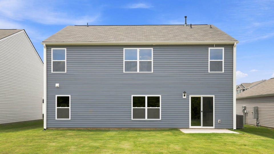 Back exterior with large backyard.