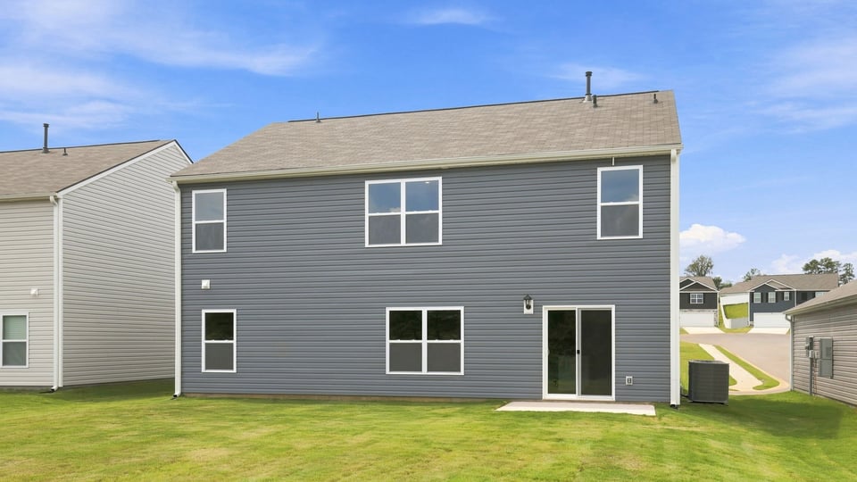Back exterior with large backyard.