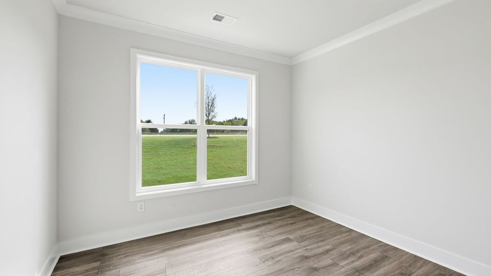 Living room with fireplace and window.