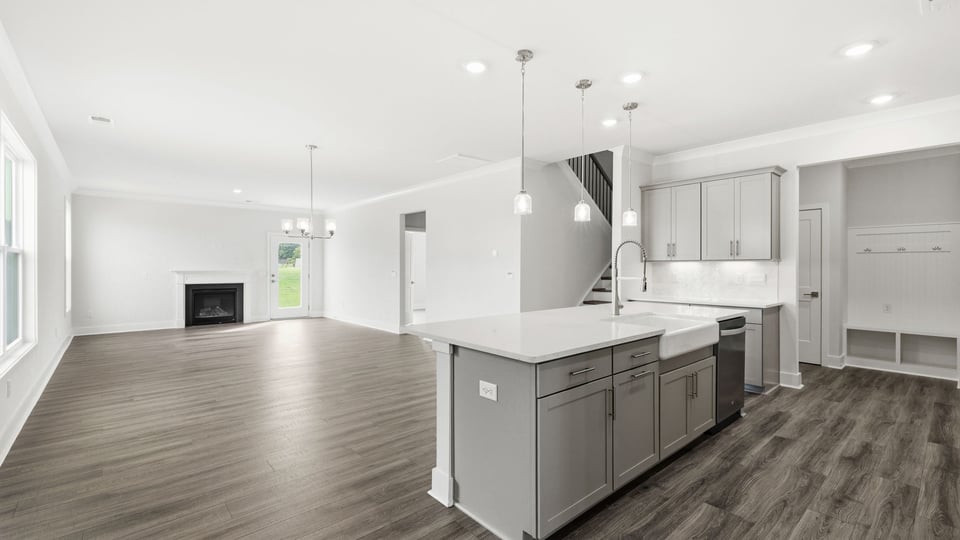 Kitchen and quartz countertops and stainless steel appliances.