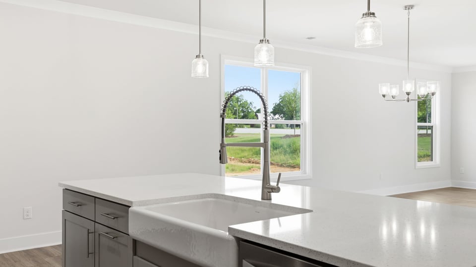 Kitchen and quartz countertops and stainless steel appliances.