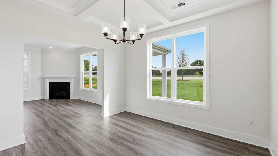 Living room with windows and fireplace.