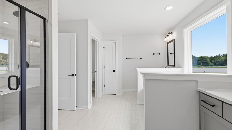 Bathroom with walk in shower and bathtub.