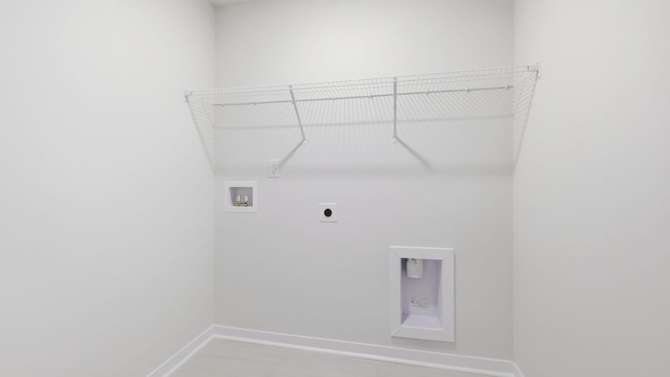 Laundry room with hanging storage racks.
