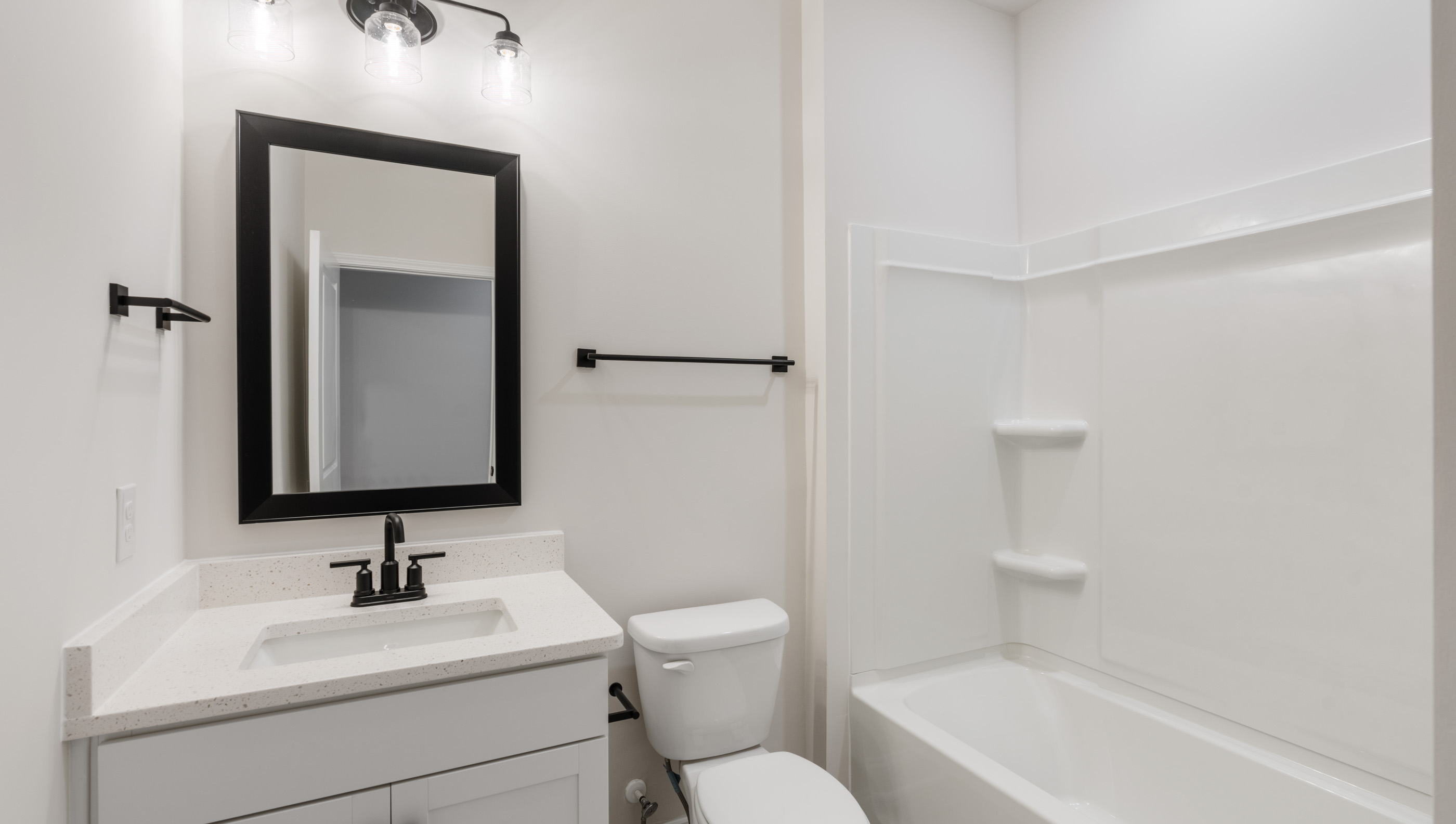Bathroom with vanity and tub.