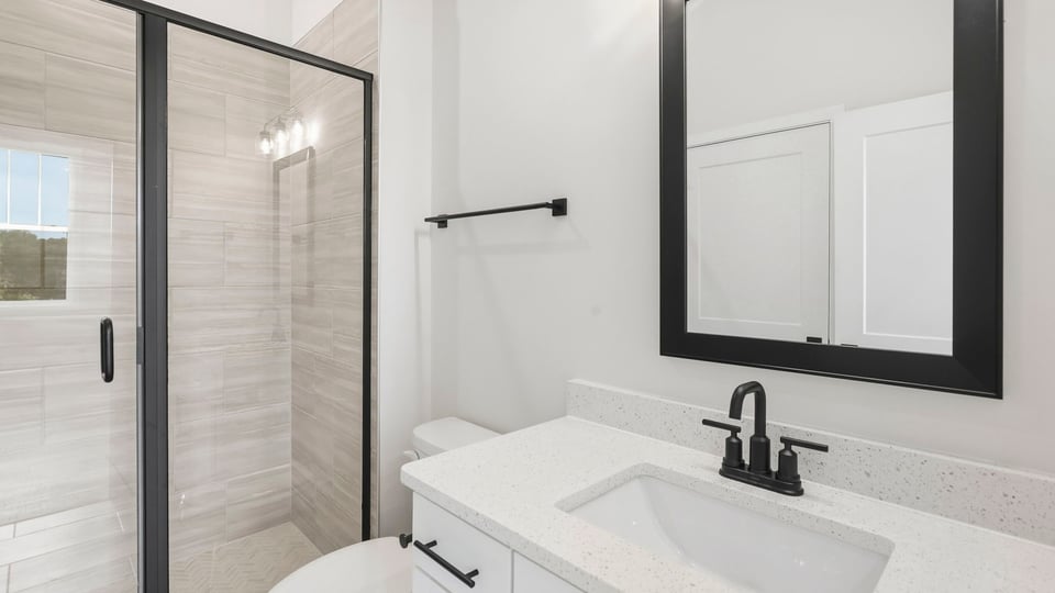Bathroom with walk in shower.