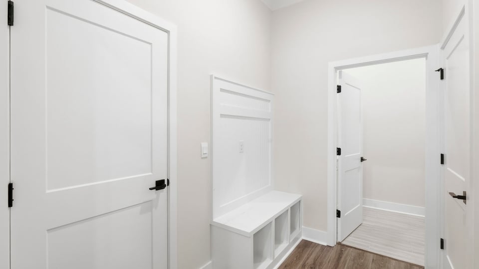 Laundry room with cabinets.