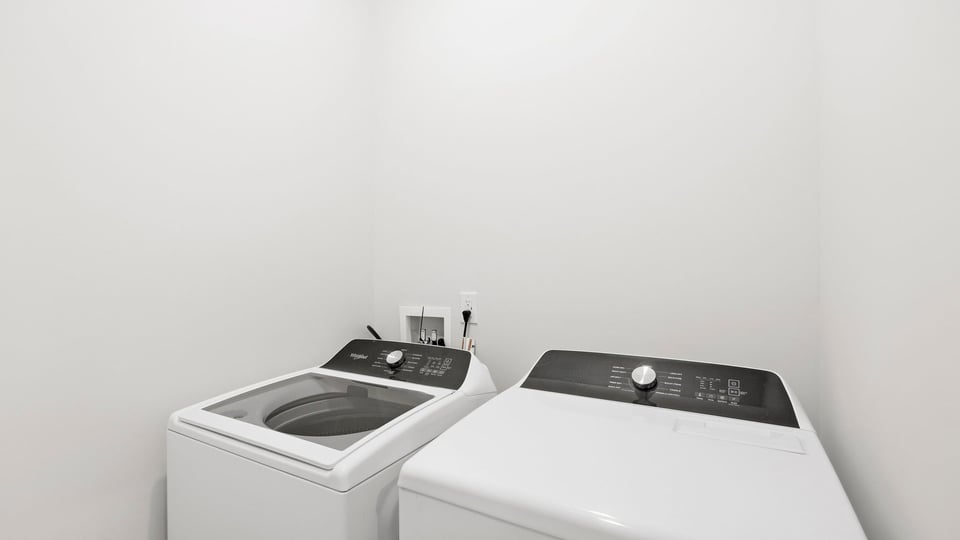 Laundry room with cabinets.