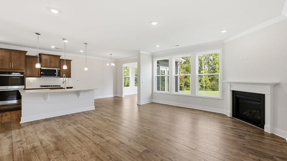 Living room with windows and fireplace.