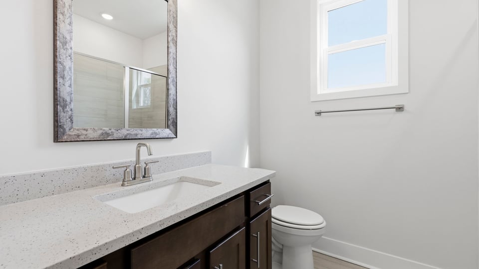 Bathroom with single vanity sink and shower.