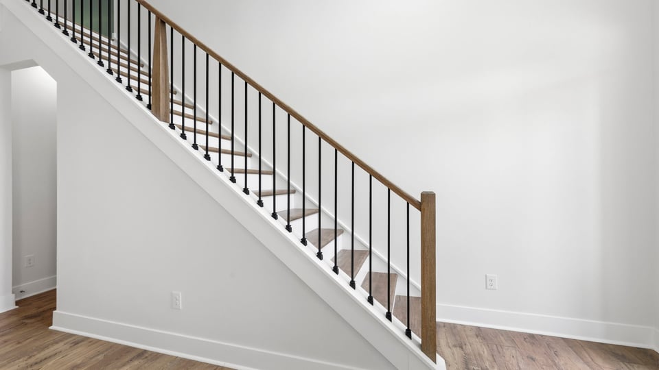 View of stairs to additional bedroom