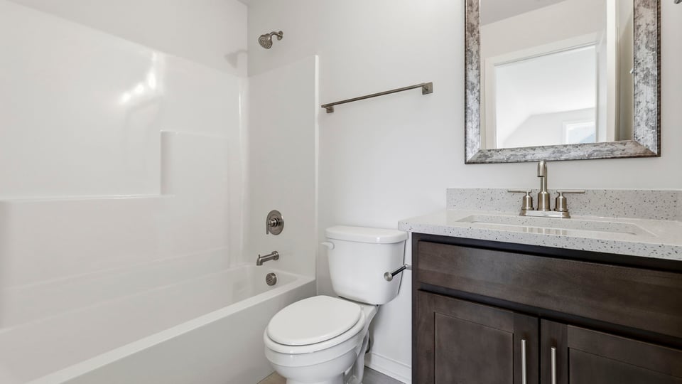 Bathroom with single vanity sink and bahtub.