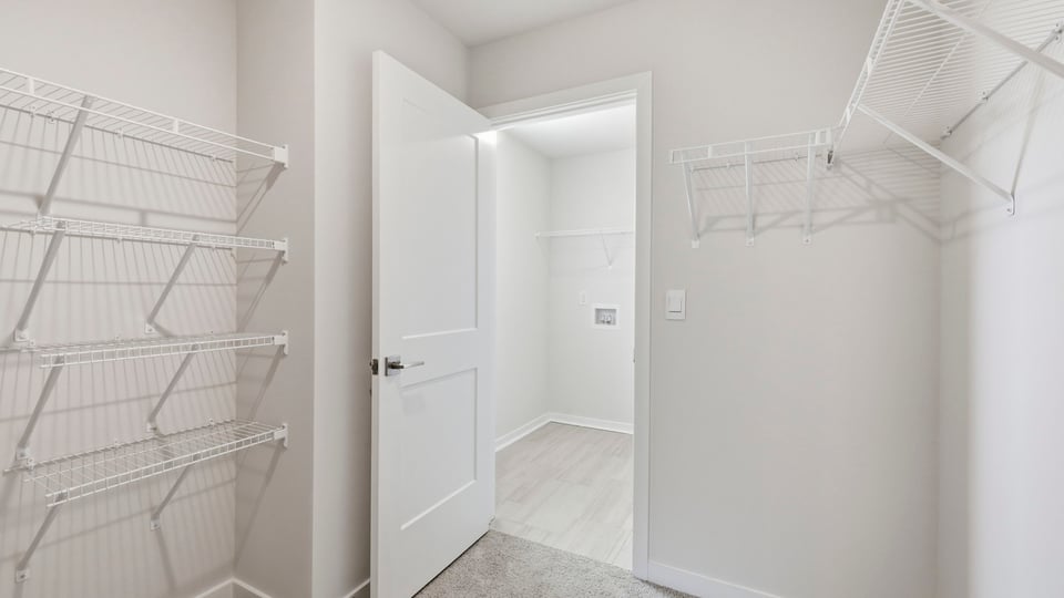 Closet with hanging storage racks.