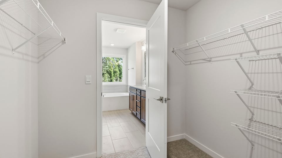 Closet with hanging storage racks.