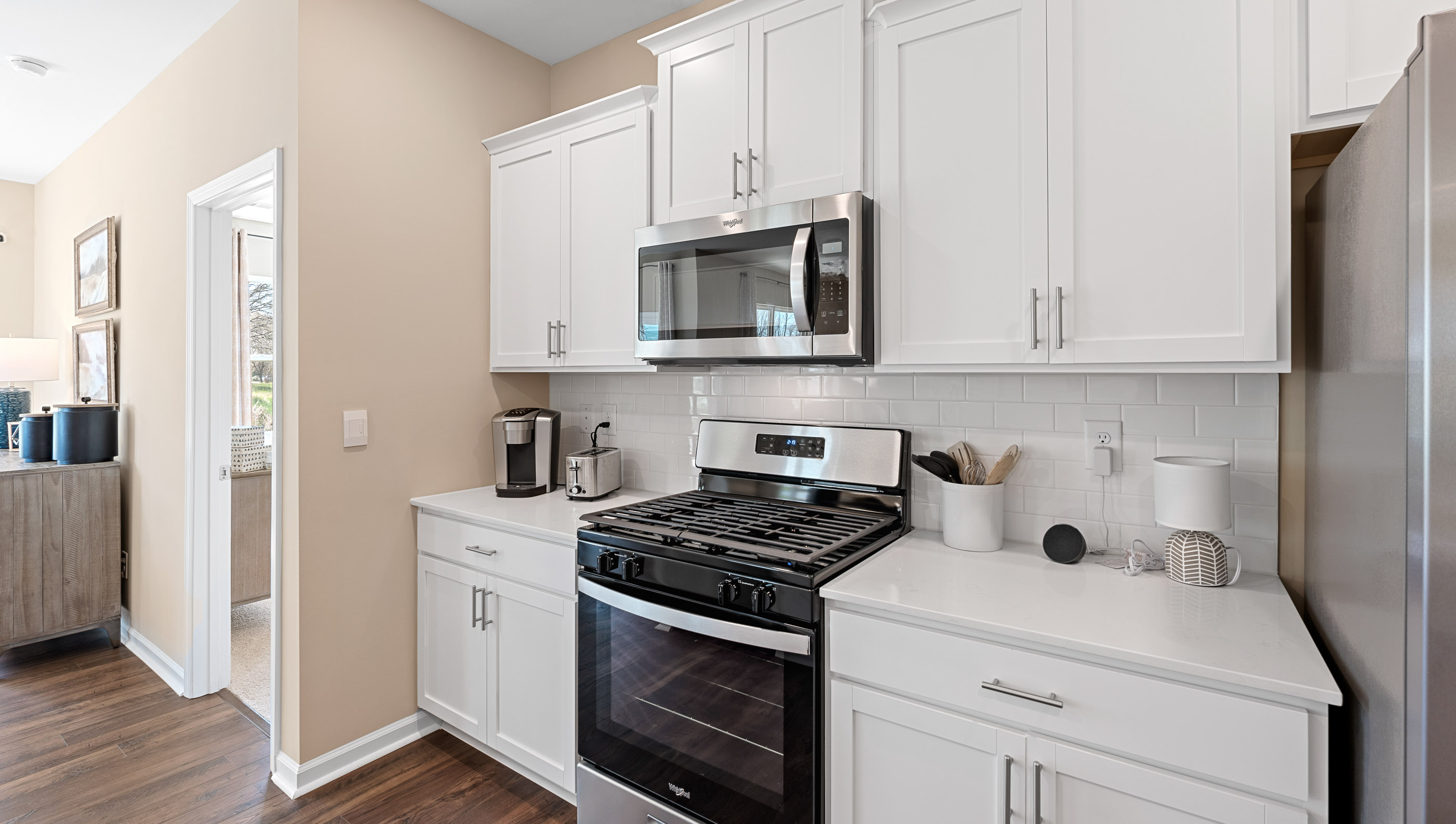 Kitchen and island with quartz countertops.