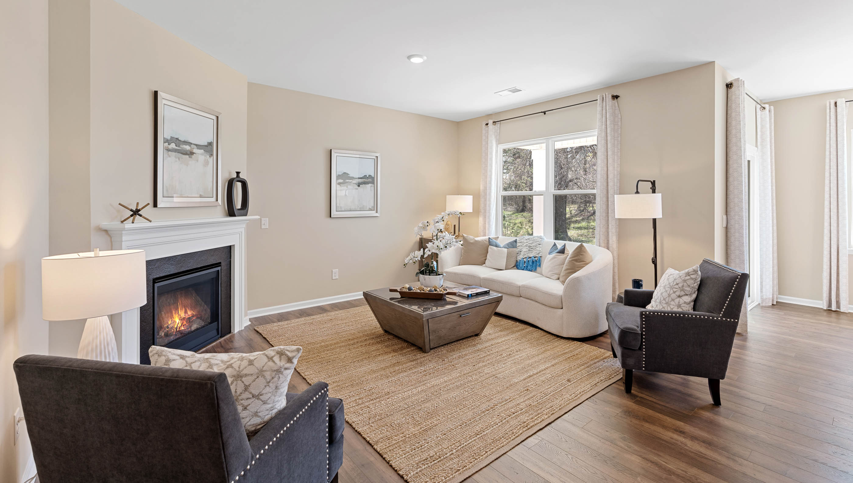 Living room with fireplace and window.