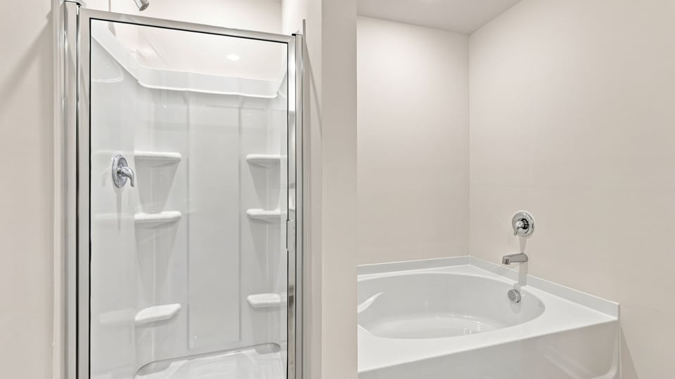 Bathroom with walk in shower.