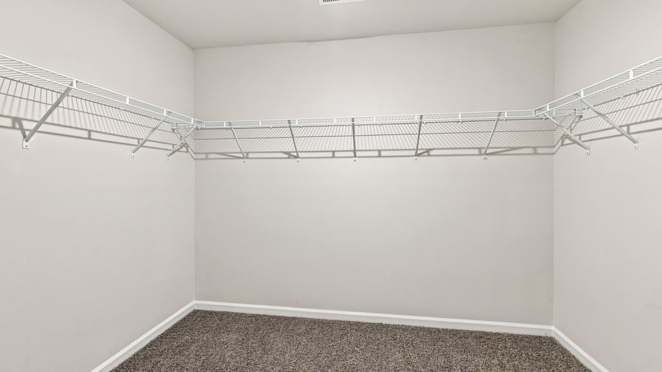 Closet with hanging storage racks.