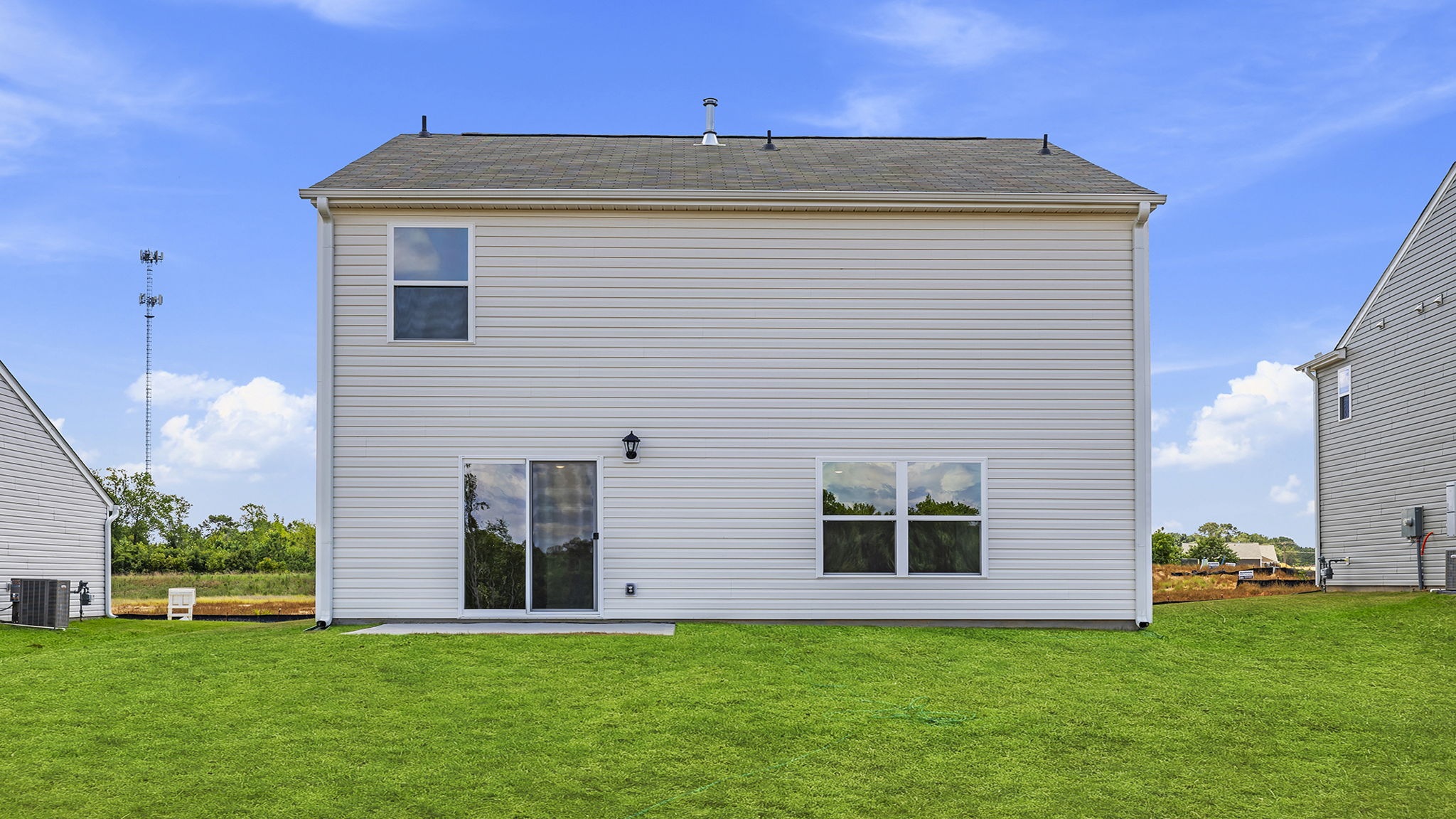 Back exterior with large backyard.