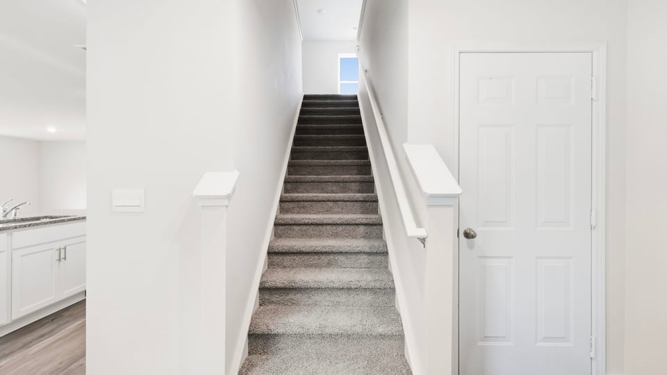 View of stairs to bedroom.