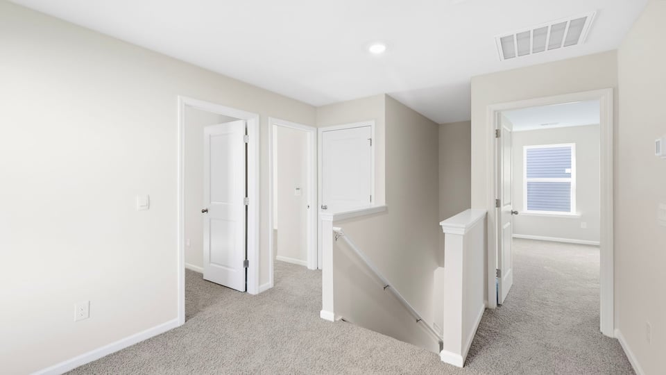 Loft area with carpet.