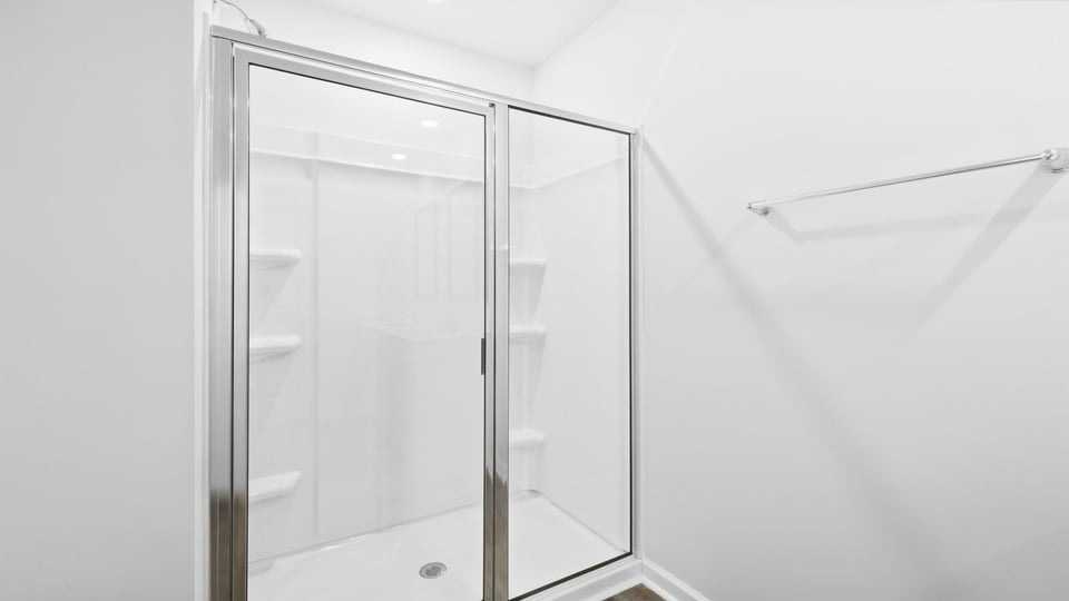 Bathroom with walk in shower.