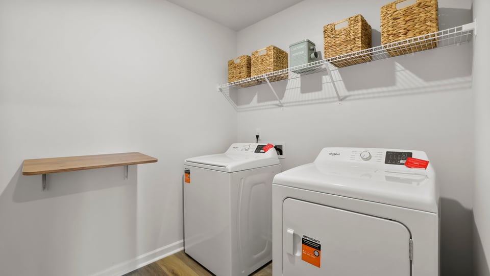 Laundry room with shelf.
