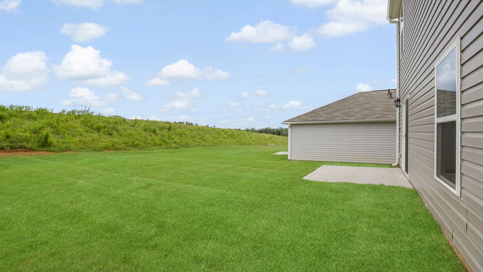 Back exterior with large backyard.