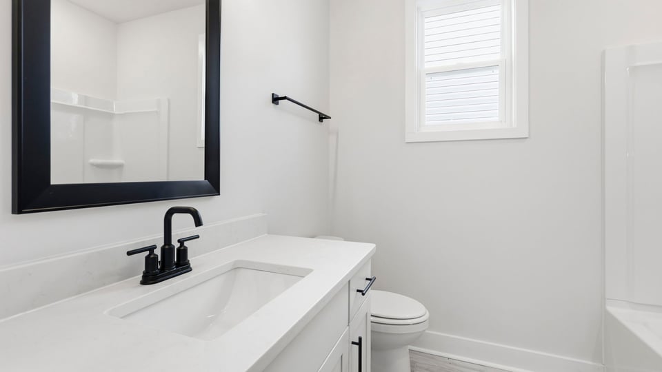Bathroom with single vanity sink and shower.