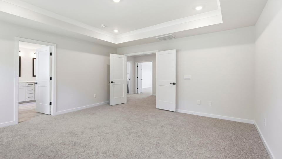 Bedroom with carpet and window.