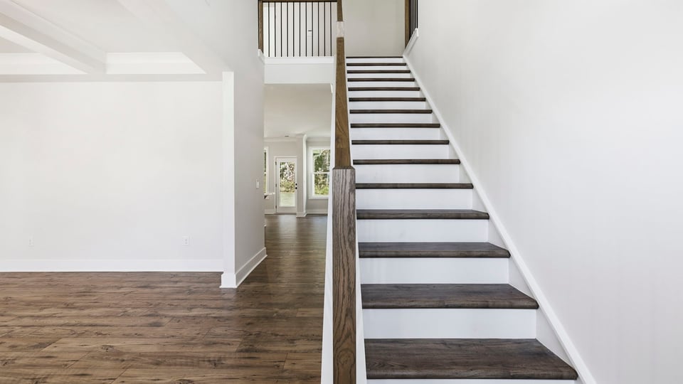 Stairs to additional bedrooms.