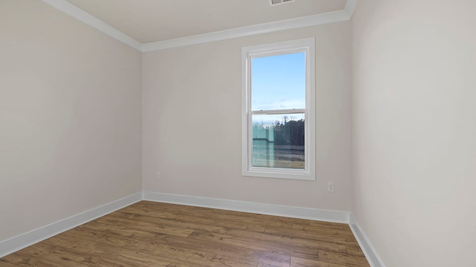 Bedroom with window and closet.