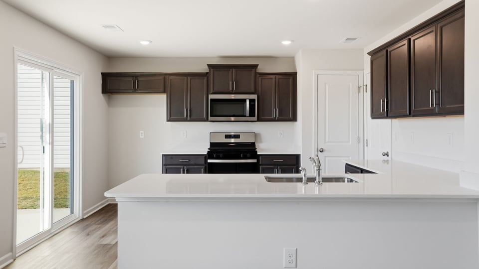 Kitchen with quartz countertops.