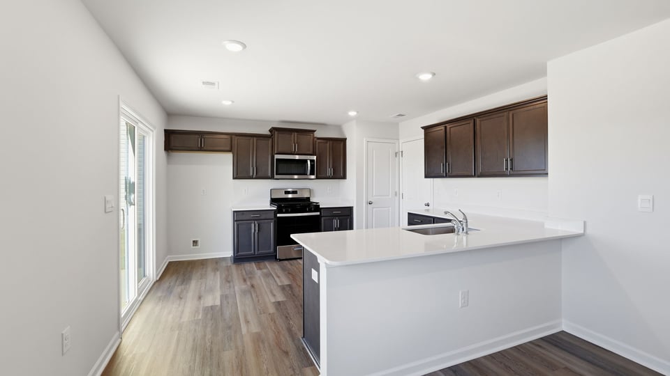 Kitchen with quartz countertops.