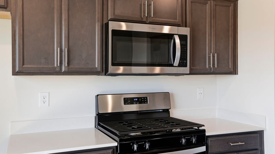 Kitchen with quartz countertops.