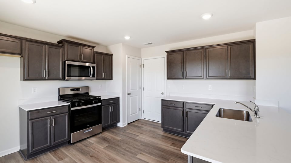 Kitchen with quartz countertops.