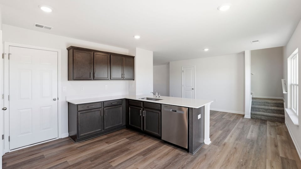 Kitchen with quartz countertops.