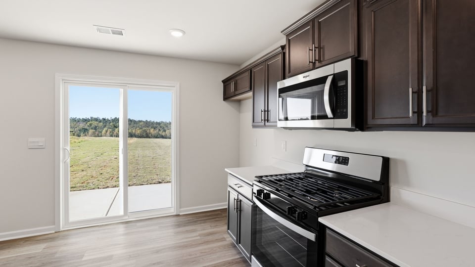 Kitchen with quartz countertops.