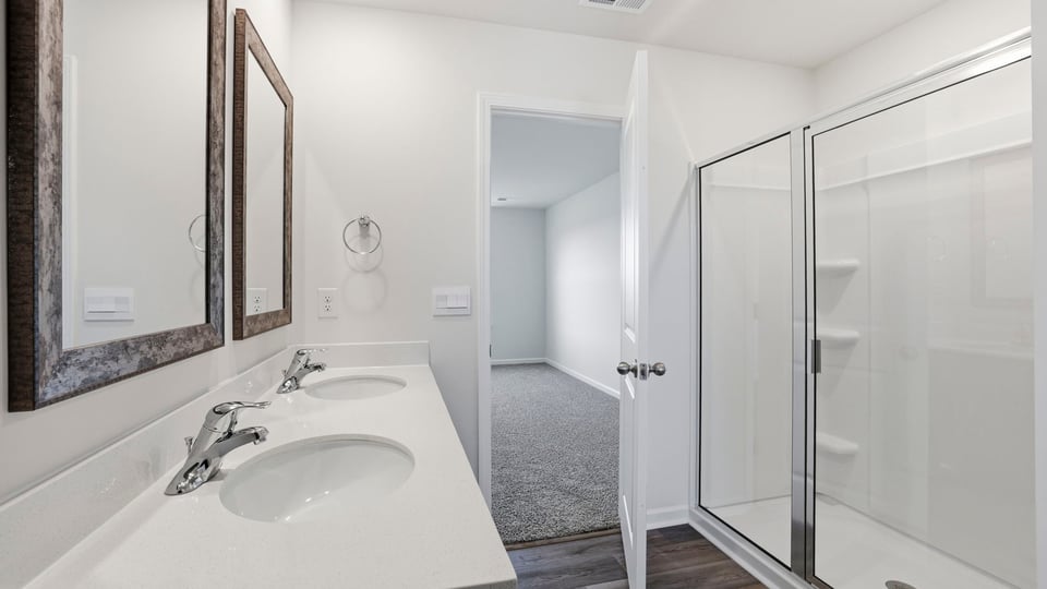 Bathroom with walk in shower.