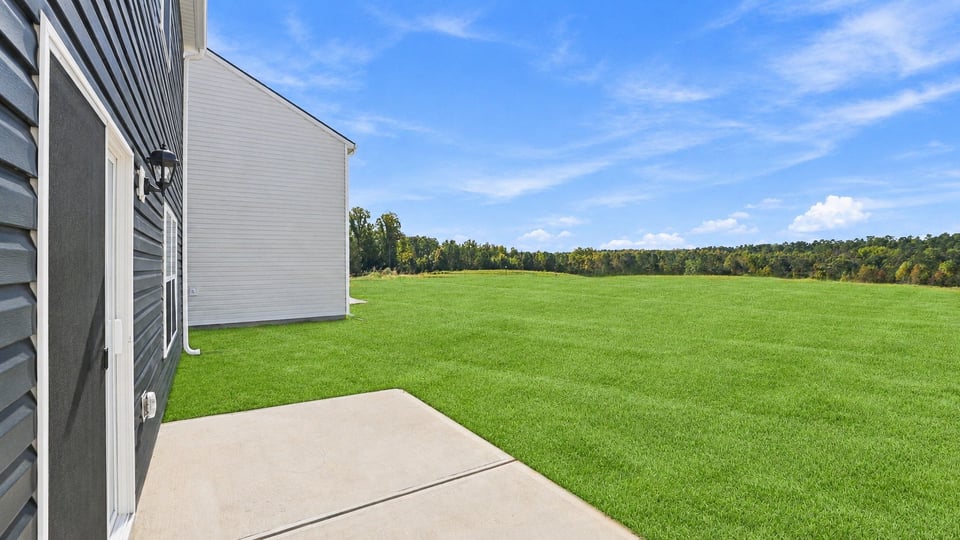 back exterior of home with patio.