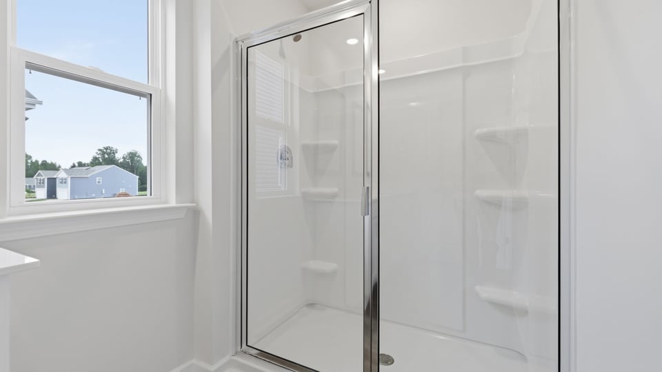 Bathroom with walk in shower.