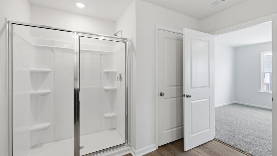 Bathroom with walk in shower.