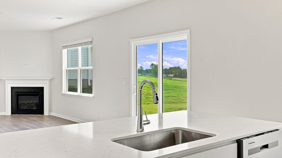 Kitchen with island and cabinets.