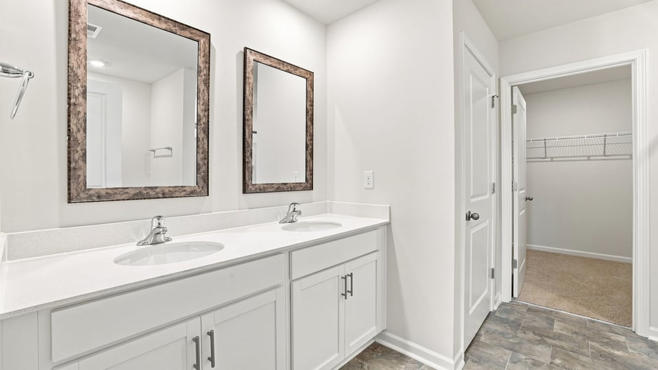 Primary bathroom with double vanity sinks.