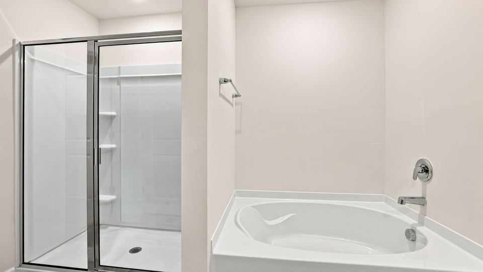 Primary bathroom with double vanity sinks.
