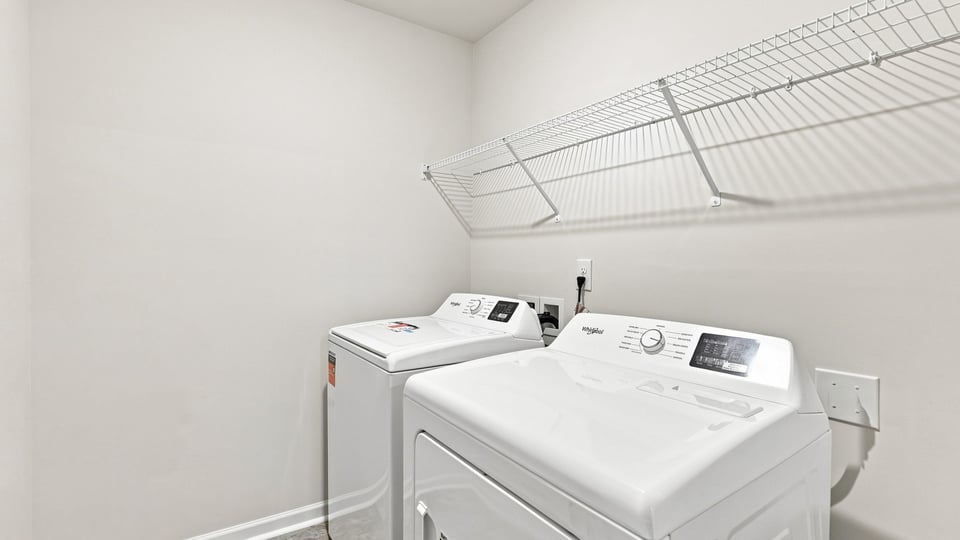 Laundry room with shelf.