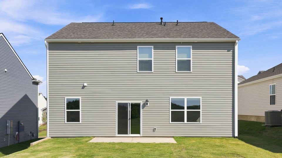 Back exterior with large backyard.