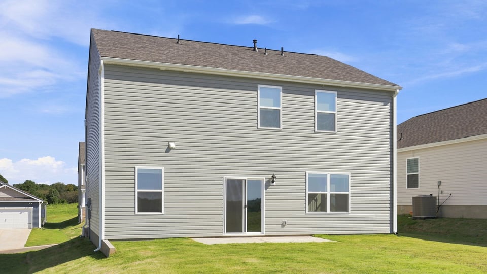 Back exterior with large backyard.