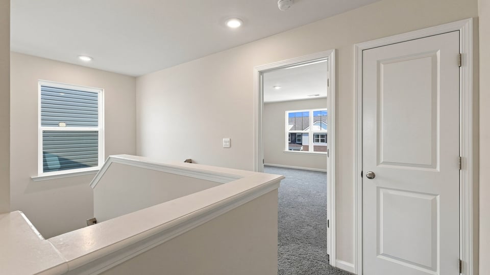 Loft area with carpet.