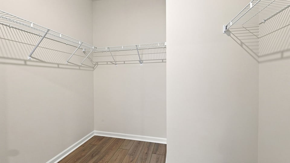 Closet with hanging storage racks.